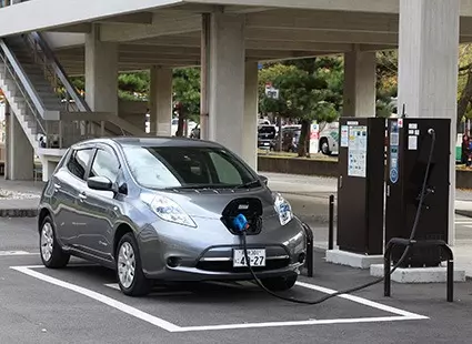 electric car charging outside carpark